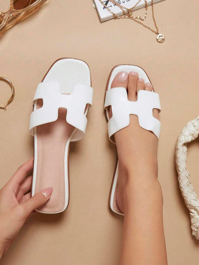 Luxe-inspirerade vita slides med sele