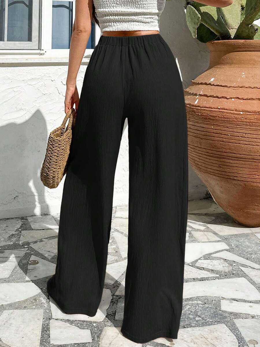 Stilrena byxor med asymmetrisk midja