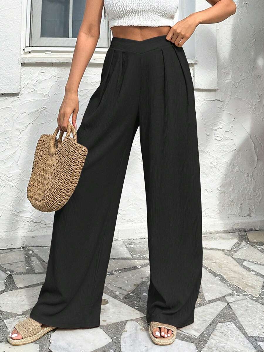 Stilrena byxor med asymmetrisk midja