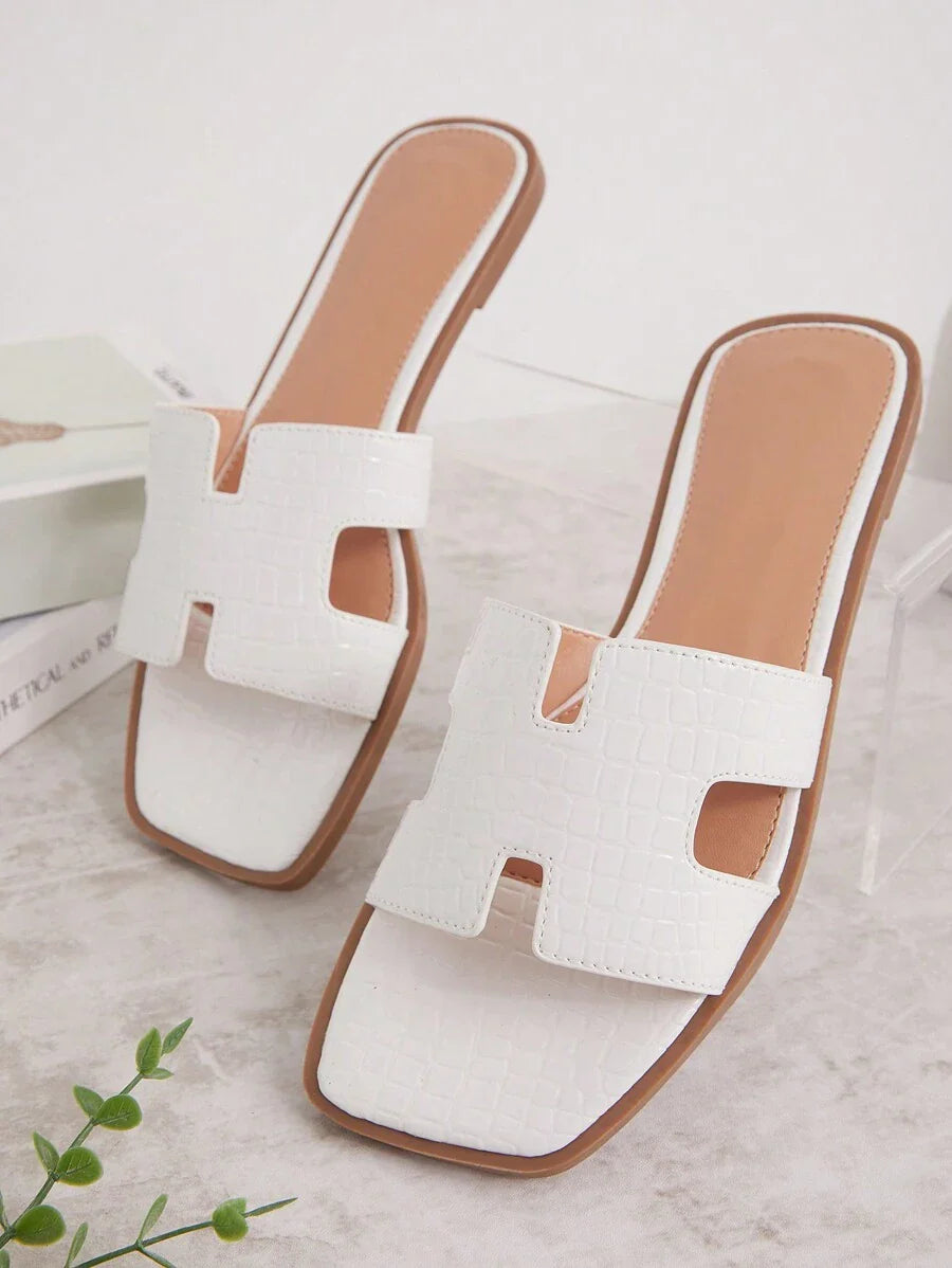 Luxe-inspirerade vita slides med sele