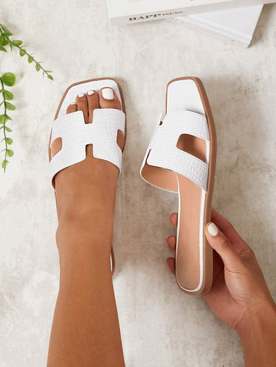 Luxe-inspirerade vita slides med sele