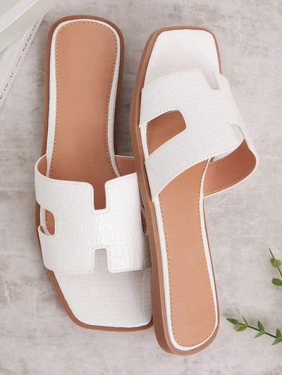 Luxe-inspirerade vita slides med sele