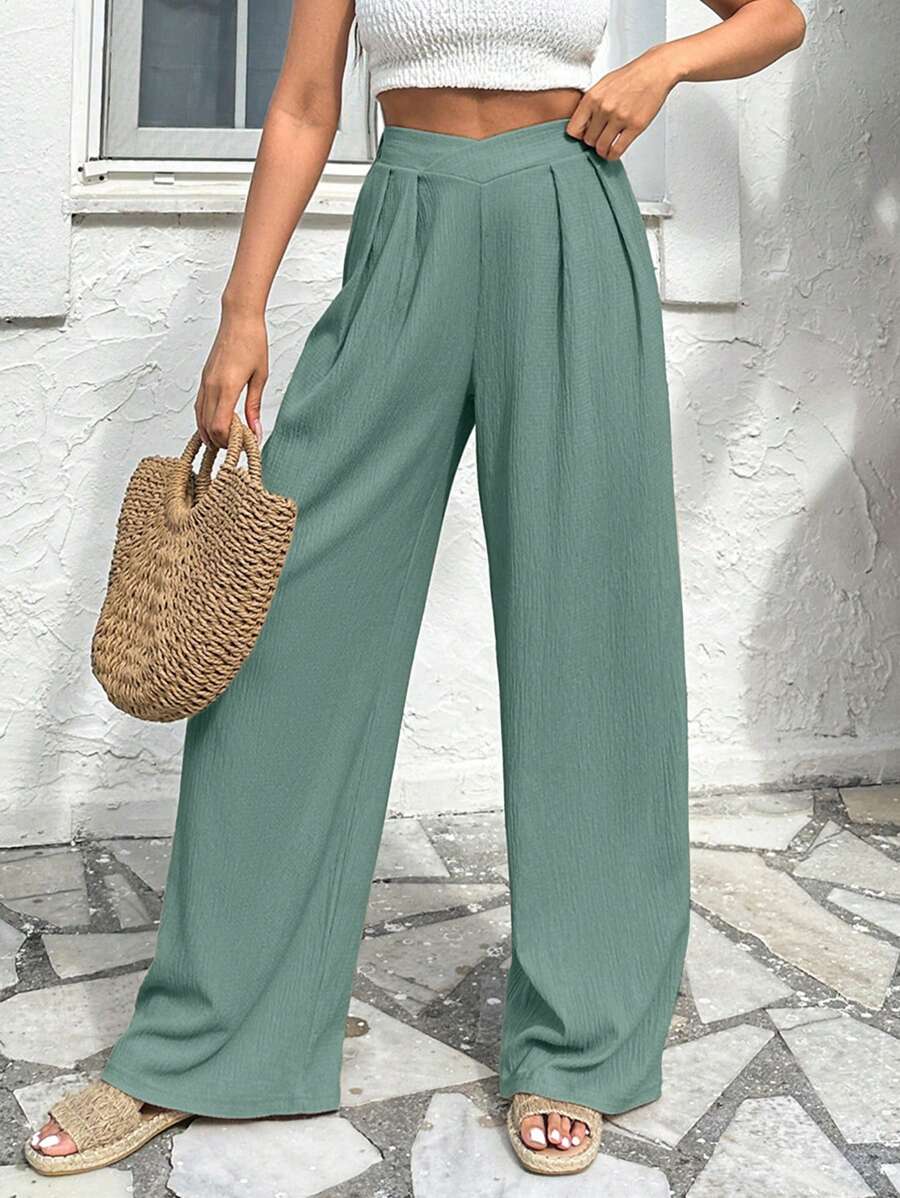 Stilrena byxor med asymmetrisk midja