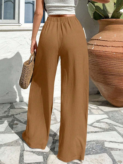 Stilrena byxor med asymmetrisk midja