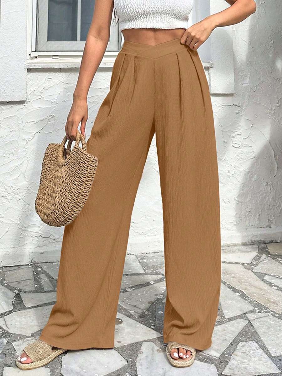 Stilrena byxor med asymmetrisk midja