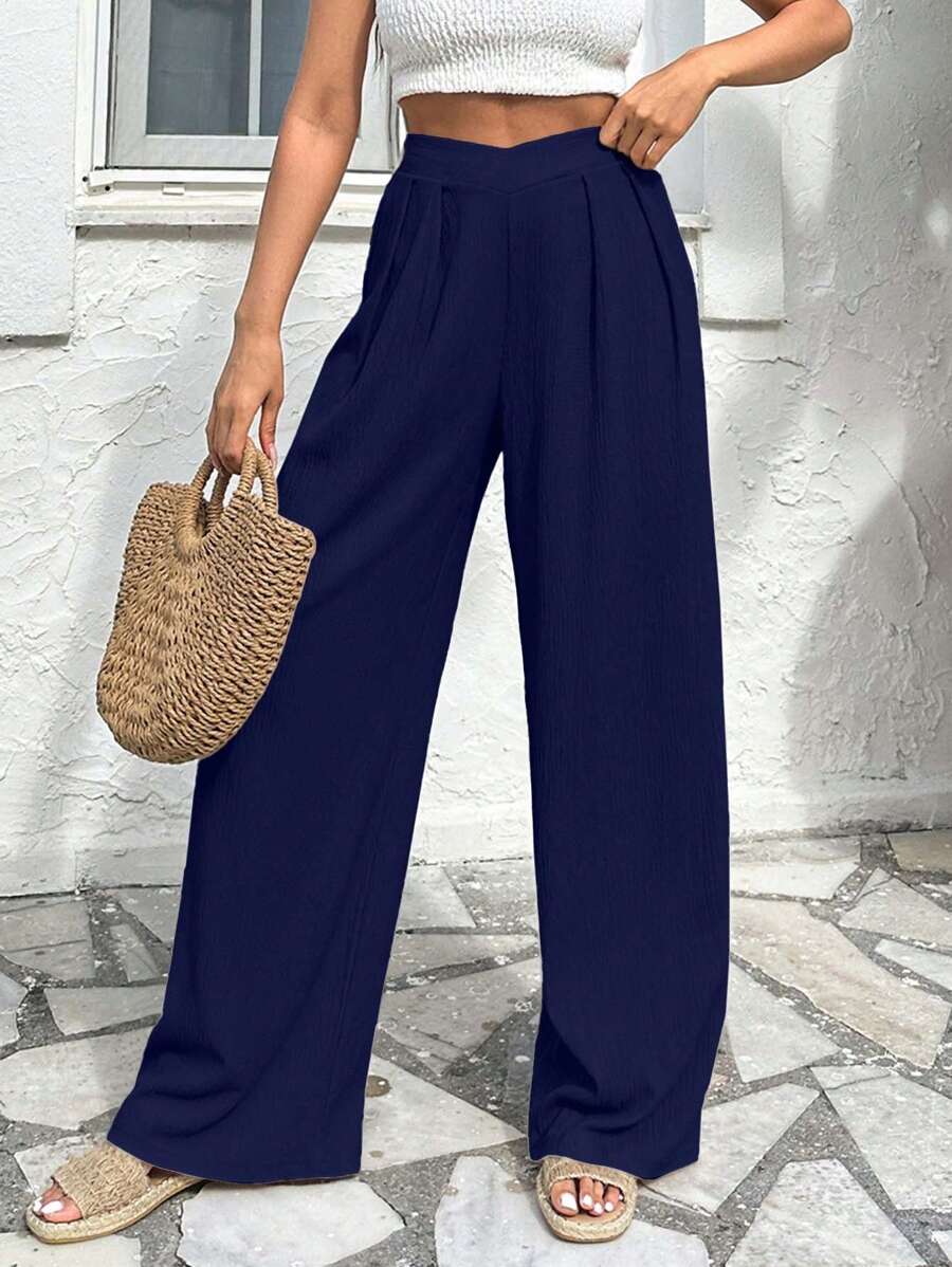 Stilrena byxor med asymmetrisk midja